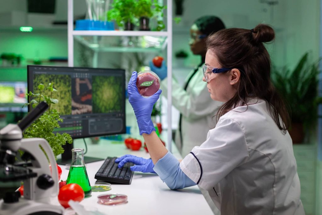 chemist-researcher-holding-petri-dish-with-vegan-m-2026-01-08-02-16-36-utc